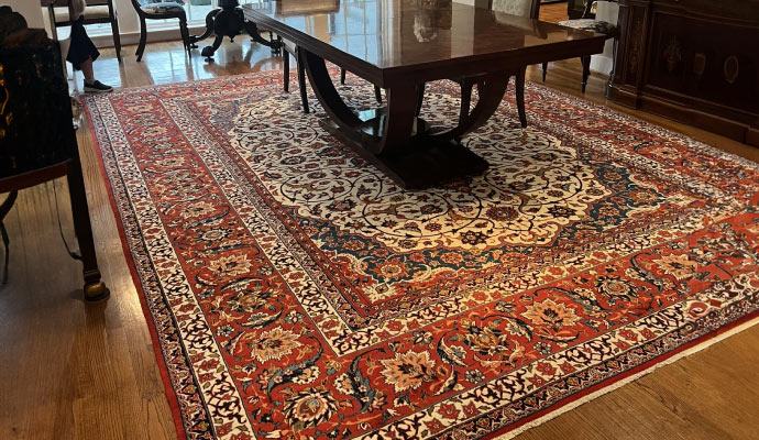 A beautiful rug is placed in the room.